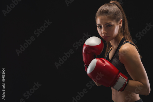 Gorgeous young woman with boxing gloves photo