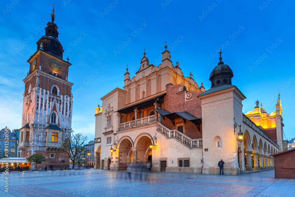 Obraz premium Town Hall tower and Krakow Cloth Hall at dusk, Poland