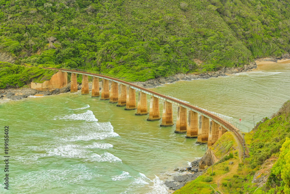 Aerial view of Kaaimans River Railway Bridge from popular Dolphin Point lookout on the Garden Route near Wilderness, Western Cape, South Africa. Aerial view of Kaaimans River Railway Bridge from popular Dolphin Point lookout on the Garden Route near Wilderness, Western Cape, South Africa.
