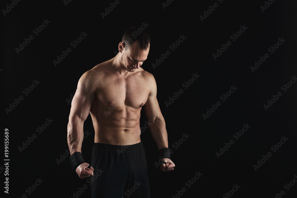Fototapeta premium Strong athletic man showes naked muscular body