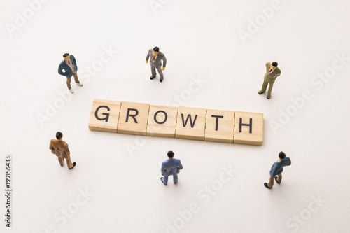 businessman figures meeting on growth word
