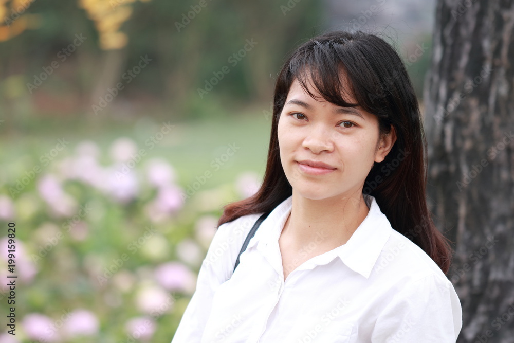 woman at the flower garden in Hanoi, Vietnam woman at the flower garden in Hanoi, Vietnam