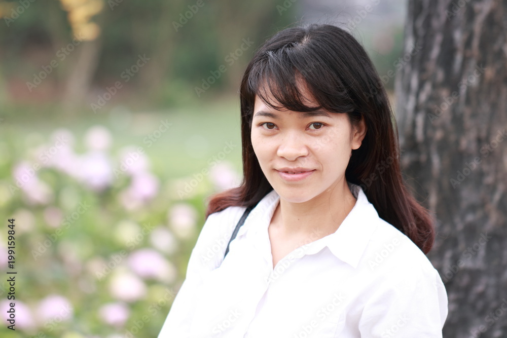 woman at the flower garden in Hanoi, Vietnam woman at the flower garden in Hanoi, Vietnam
