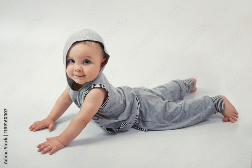 Little boy doing exercise in Studio on white background Little boy doing exercise in Studio on white background