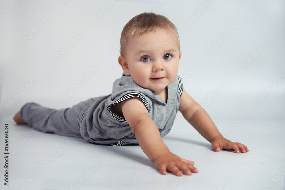 Little boy doing exercise in Studio on white background Little boy doing exercise in Studio on white background