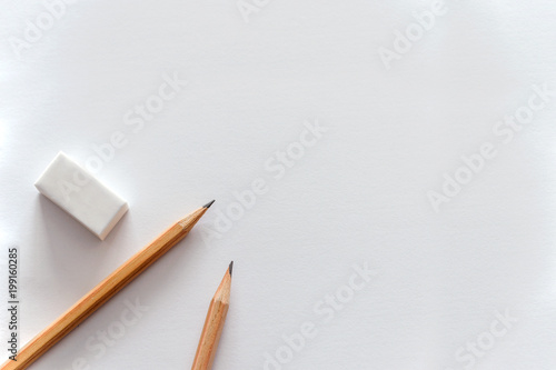 back to school concept, pencil on white paper background photo