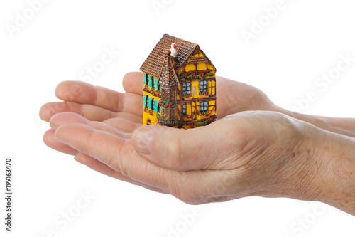 Hands and house