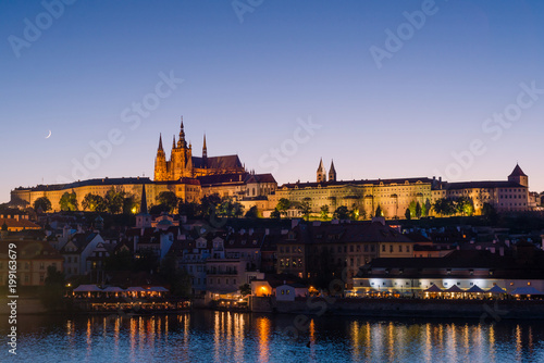 Prague, Bohemia, Czech Republic. Hradcany is the Praha Castle with churches, chapels, halls and towers. Evening view of the tourist attraction.