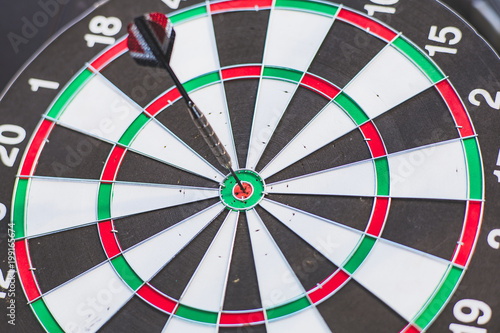 Goal for team success concept, Darts at the center of the dart board.
