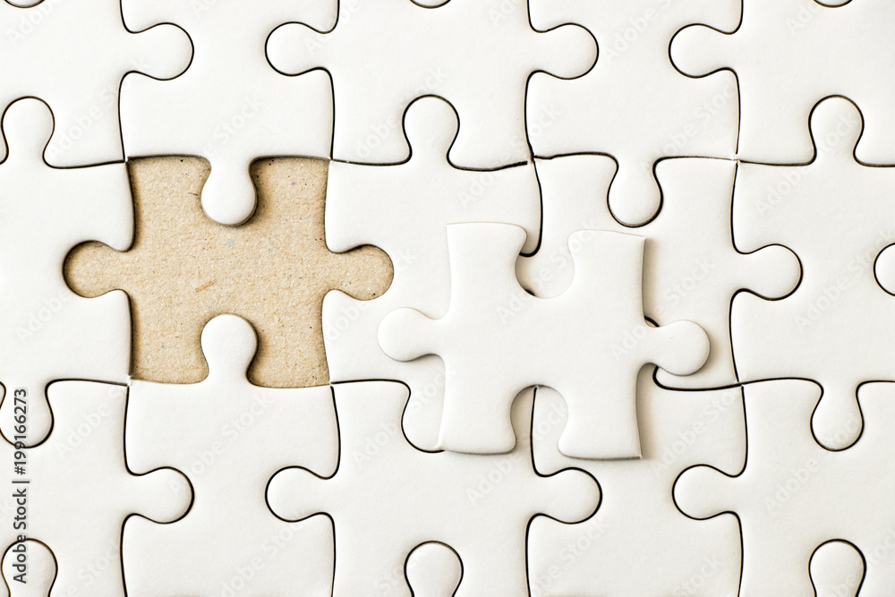 Closed up background of white plain jigsaw wait missing piece to match or fulfill Closed up background of white plain jigsaw wait missing piece to match or fulfill