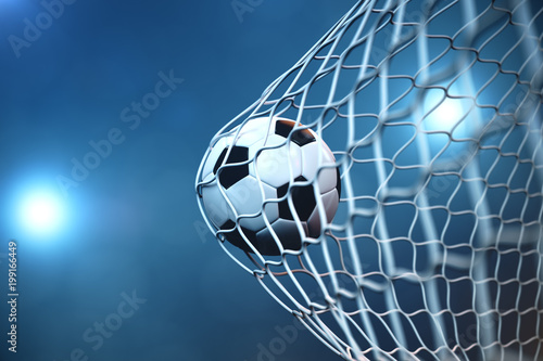 3d rendering soccer ball in goal. Soccer ball in net with spotlight or stadium light background, Success concept © rost9