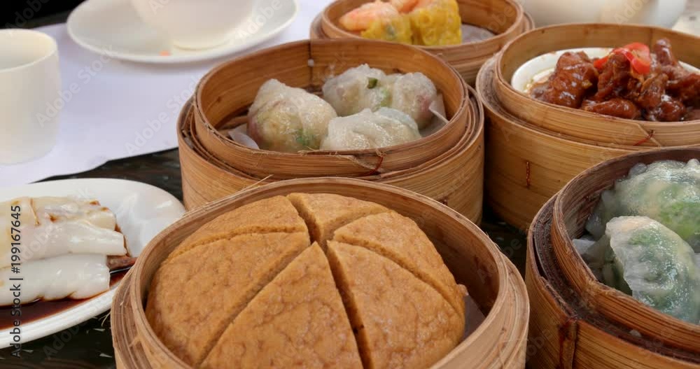 Eating chinese dim sum in restaurant Eating chinese dim sum in restaurant