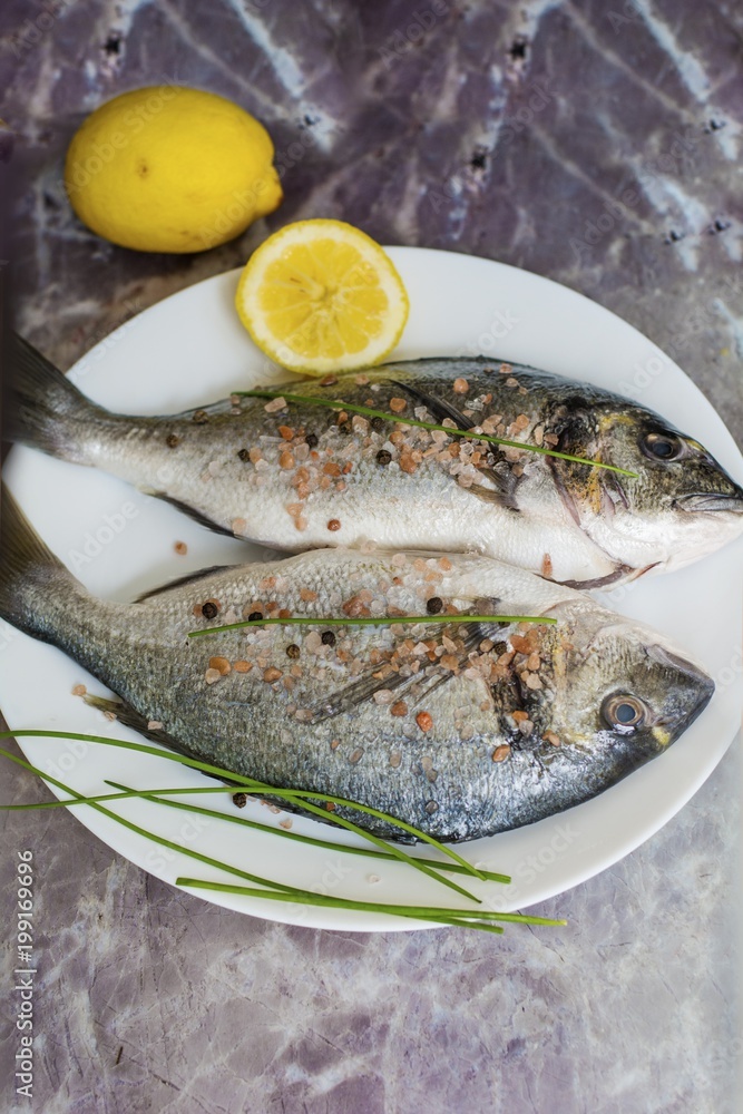 Fresh Raw Sea Bream Fish with Lemon Fresh Raw Sea Bream Fish with Lemon