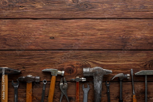 Border of repair tools on wood background with copy space