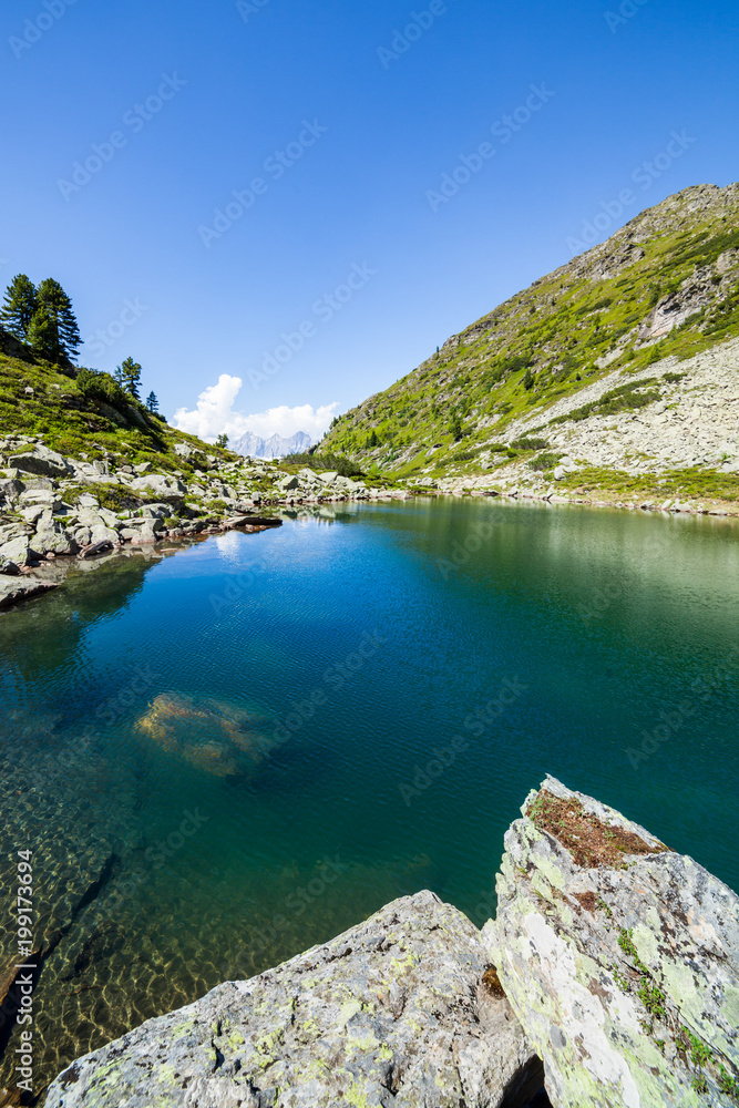 Lake Obersee between mountains Rippetegg and Schober and mountain Dachstein