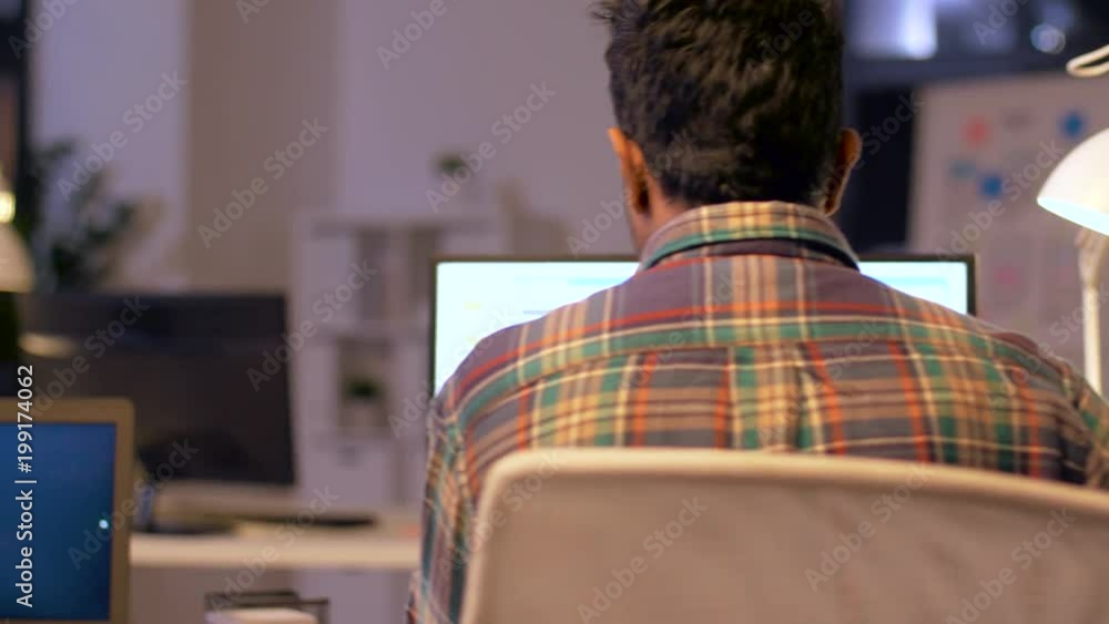 deadline, technology and people concept - programmers with computers working together late at night office deadline, technology and people concept - programmers with computers working together late at night office
