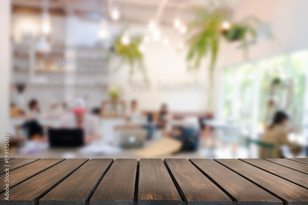 Empty wooden table space platform and blurred resturant or coffee shop background for product display montage