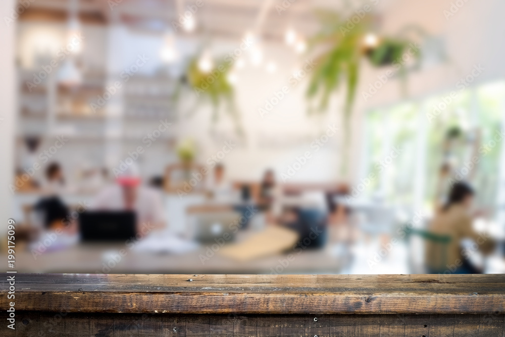 Empty wooden table space platform and blurred resturant or coffee shop background for product display montage Empty wooden table space platform and blurred resturant or coffee shop background for product display montage