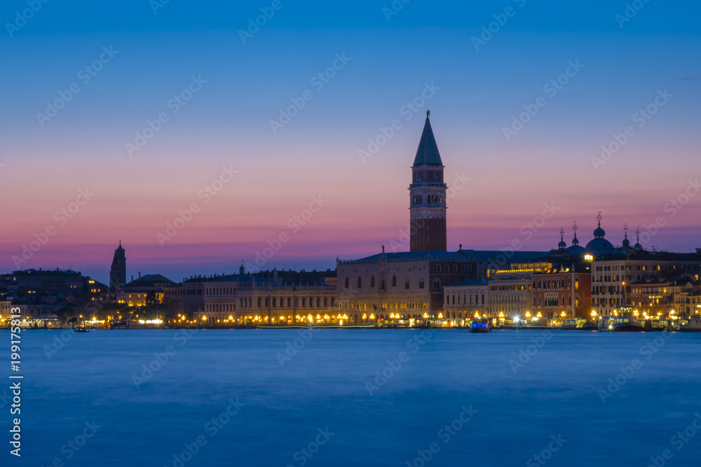 Fototapeta premium Venice at twilight. Blue hour on the San Marco basin. Italian landscape. Venice postcard.