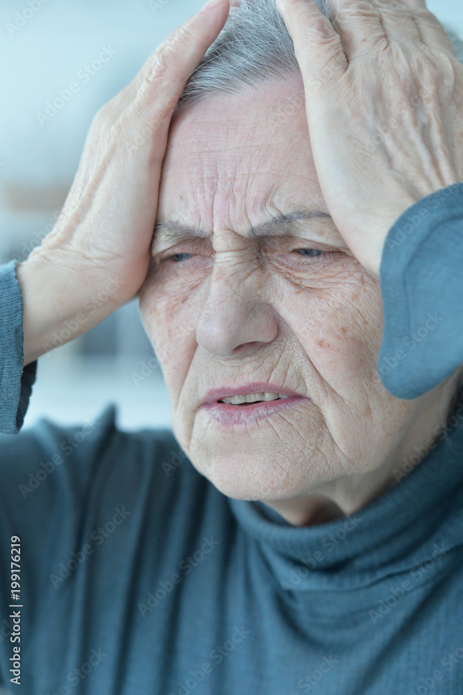 Obraz premium sad senior woman