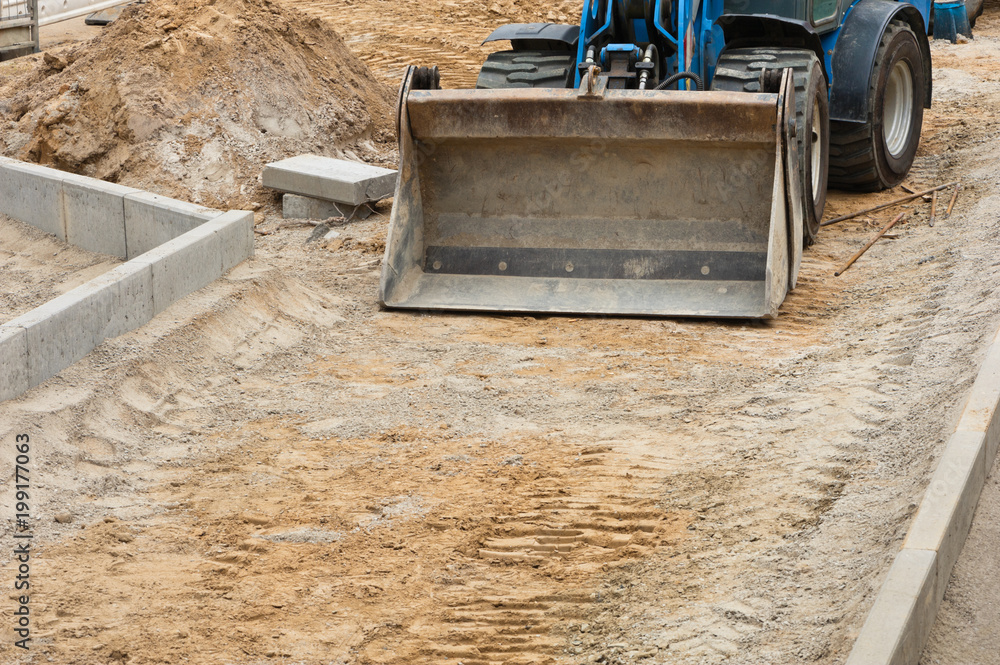 Strassenbau mit dem Radlader StockFoto Adobe Stock
