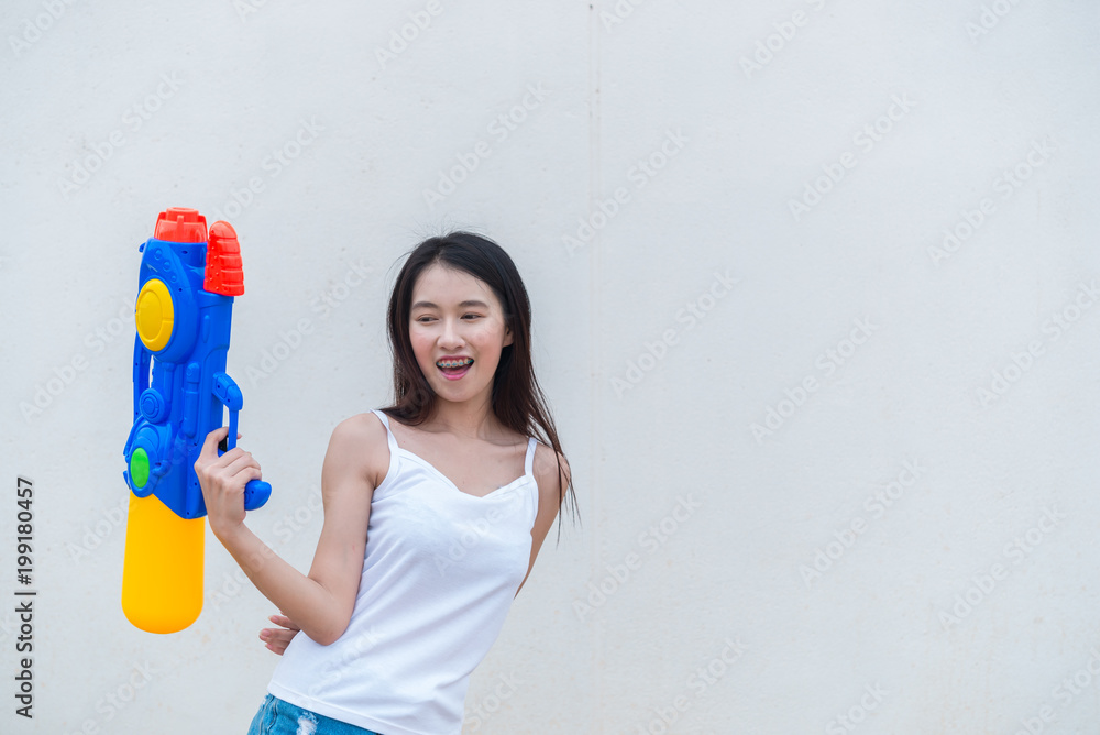 Asian sexy woman with water in hand on white background,Festival songkran day at thailand,The best of festival of thai,Land of smile Asian sexy woman with water in hand on white background,Festival songkran day at thailand,The best of festival of thai,Land of smile