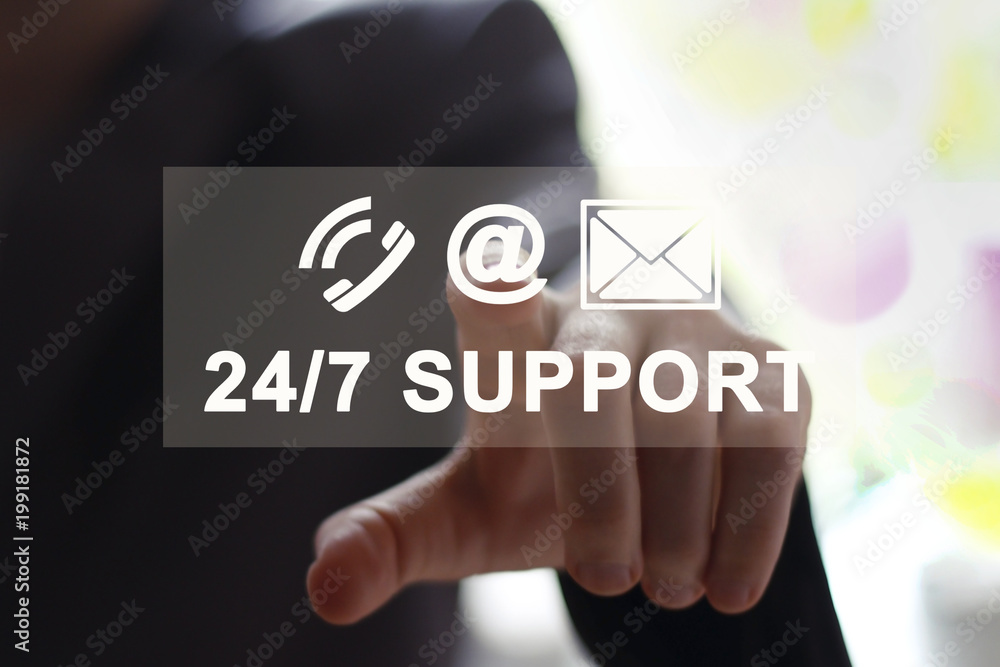 Businessman pressing button 24 hours support service on technology panel. Businessman pressing button 24 hours support service on technology panel.