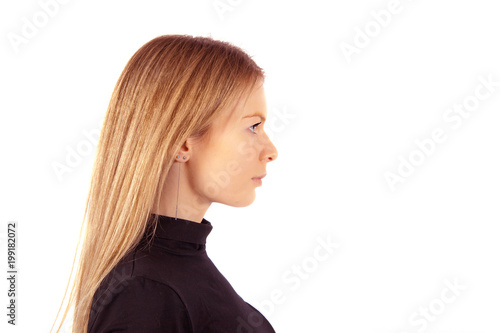 Portrait of the young blond woman in profile