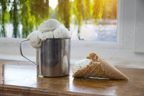 Variety of ice cream scoops in cones with chocolate, vanilla and strawberry