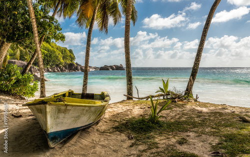 Old wooden boat on a tropical coast