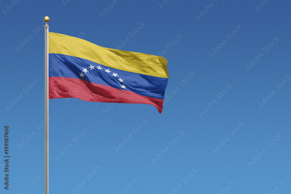 Venezuela Flag of in front of a clear blue sky