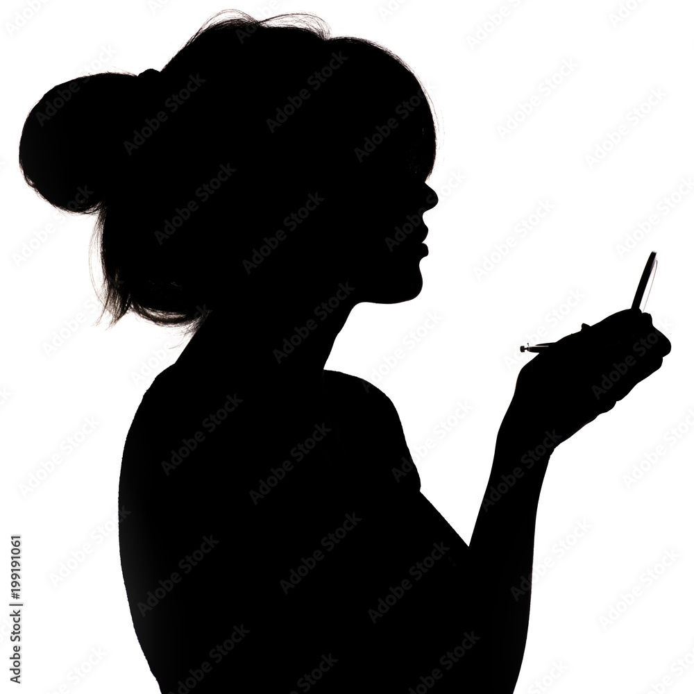 silhouette of a girl with handpicked hair, profile of a woman face looking in a pocket mirror, the concept of the beauty and style