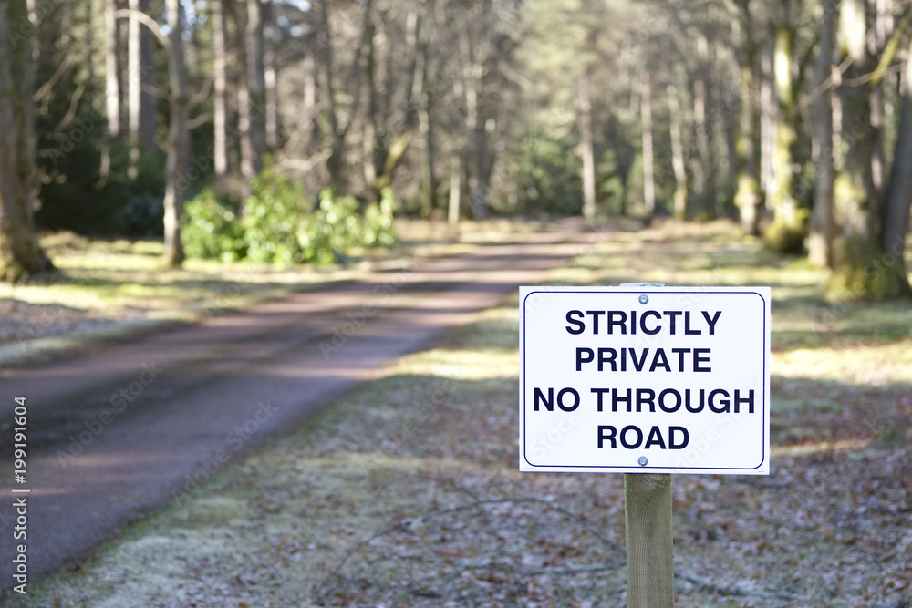 No through road strictly private road sign at entrance to estate grounds of woodlands forest landmark