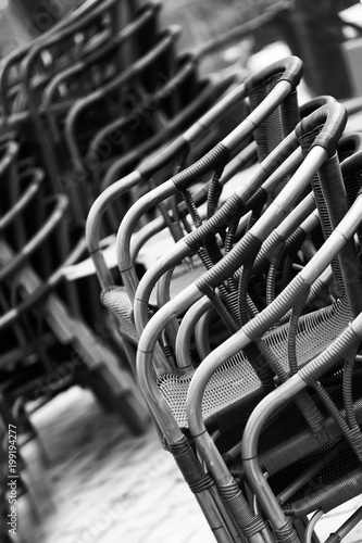 Black and white rhythmic composition of chairs.