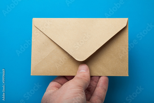 Blank recycled Envelope Mockup in hand.
