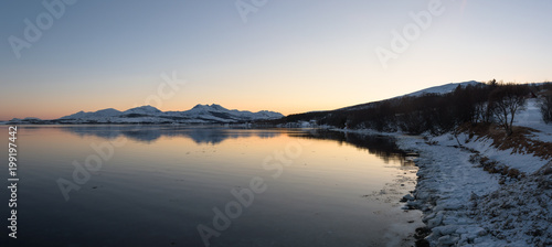 Mirror-like reflections in a Norwegian fjord near Troms    Norway