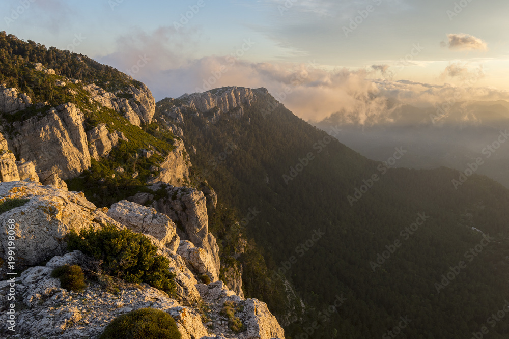 Rocky landscape at the ridge of a mountain during sunrise at Puertos de Beceite national Park