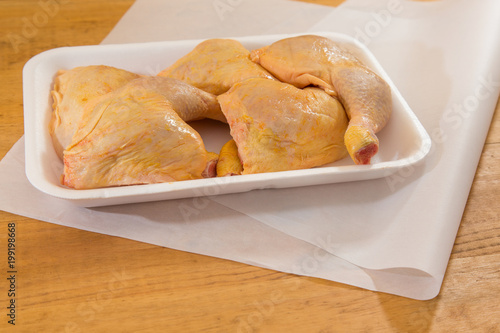 chicken legs presented in a polystyrene tray