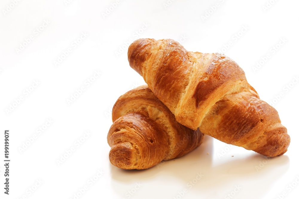 Homemade French Croissants isolated on white, selective focus