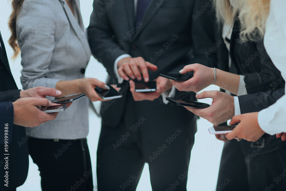 closeup.business team using smartphones .