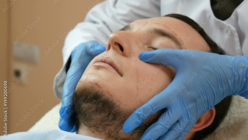 face plastic surgery. Consultation of man in plastic clinic face plastic surgery. Consultation of man in plastic clinic