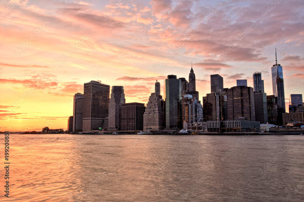 New York City Lower Manhattan with Brooklyn Bridge at Sunset New York City Lower Manhattan with Brooklyn Bridge at Sunset