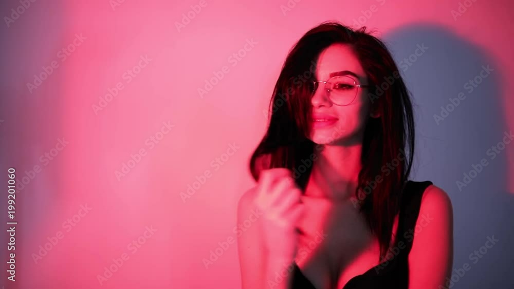 Sexy sensual woman posing in red light Sexy sensual woman posing in red light