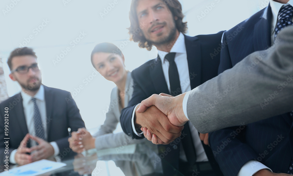 background image of handshake of business partners background image of handshake of business partners
