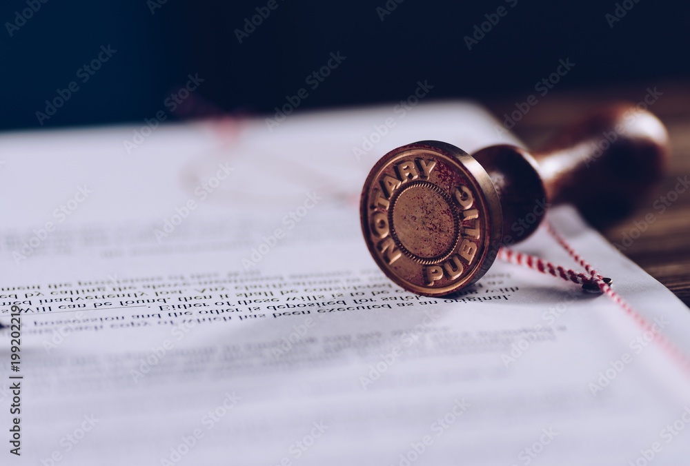 Notary public ink stamp on signed document.