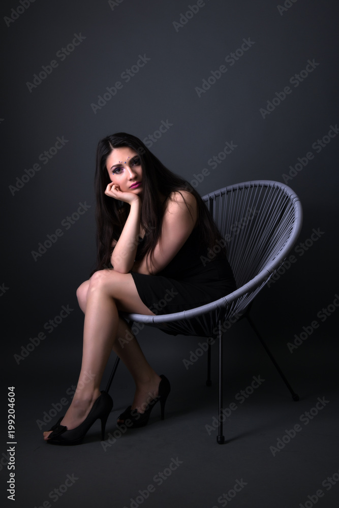 Naklejka premium Young arabic woman isolated on gray background