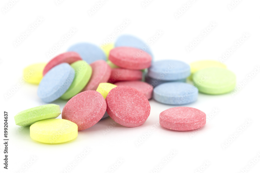 Multicolored Pills. Pharmacy theme. Isolated on white background Multicolored Pills. Pharmacy theme. Isolated on white background