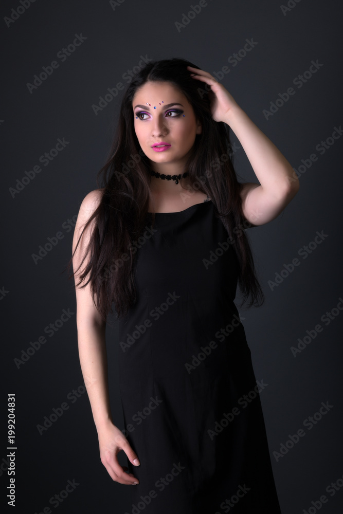 Young arabic woman isolated on gray background Young arabic woman isolated on gray background