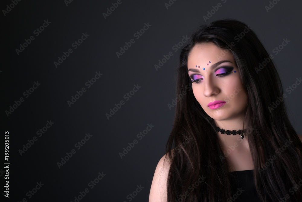 Young arabic woman  isolated on gray background