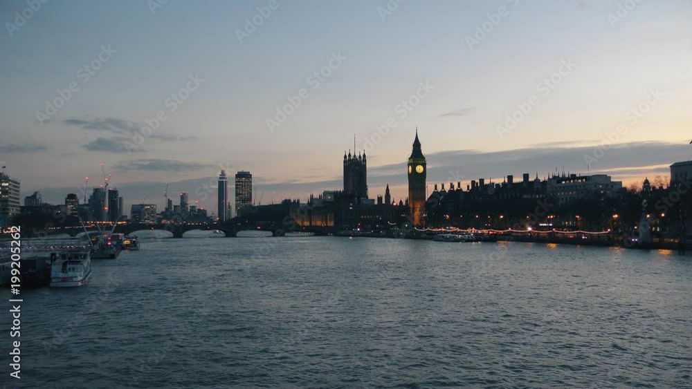 View of an embankment of the Big Ben Tower. Evening London.